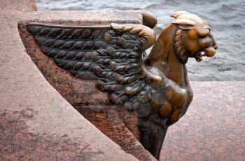 Griffin - bronze winged lion on the University Embankment in front of the Academy of Arts. St. Petersburg. Russia