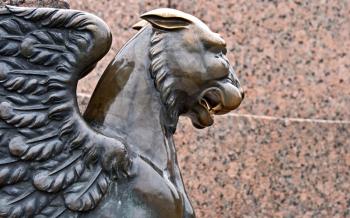 Griffin - bronze winged lion on the University Embankment in front of the Academy of Arts. St. Petersburg. Russia