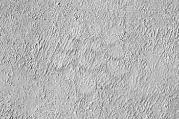 White concrete wall with rough paint layer, background photo texture