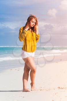 Beautiful Caucasian teenage girl posing on the beach in Dominican Republic