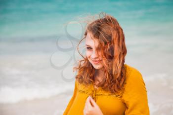 Outdoor portrait of pretty Caucasian teenage girl on the beach