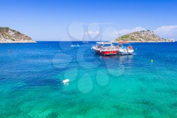 Two pleasure boats moored in Agios Nikolaos bay. Zakynthos island, Greece. Popular touristic destination