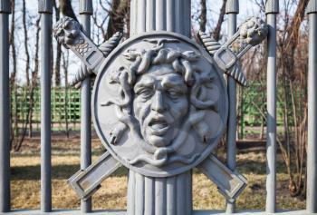Medusa. In Greek mythology it was a monster, a Gorgon, winged human female with living venomous snakes in place of hair. Decorative fence of the Summer Garden, built in 1825, St.Petersburg, Russia
