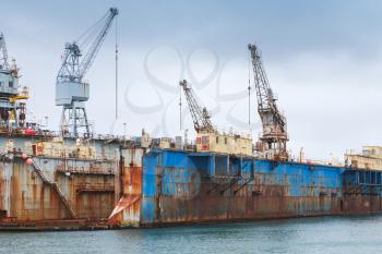 Blue rusty dry dock, shipyard in port of Hafnarfjordur, Iceland