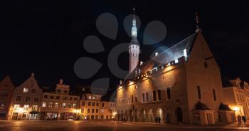 Illuminated city hall at night. Central area of old town of Tallinn, Estonia