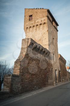 Street view of Fermo town with old fortress wall and tower, Italy. Vintage toned photo