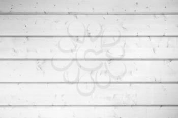 White wooden wall made of planks. Frontal flat background photo texture