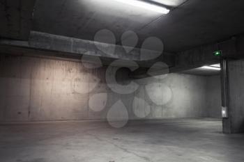 Abstract empty garage interior, background with concrete walls and white ceiling lights
