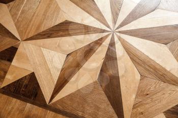 Vintage wooden parquet with geometric pattern. Background photo texture