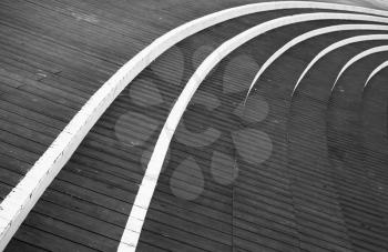 Abstract architecture background photo, dark gray round wooden stairs
