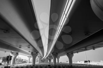 Urban highway under automotive bridges. City transportation