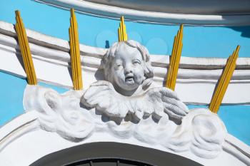 Decoration of Russian Orthodox cathedral facade, white angel sculptural portrait 