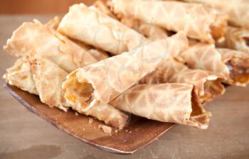 Homemade wafer cones with cream of sweet boiled condensed milk. Traditional Russian dessert