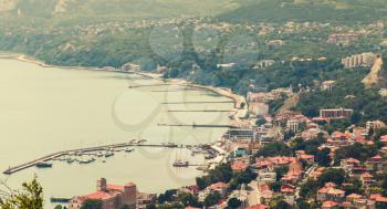 Balchik resort town cityscape, coast of Black Sea, Bulgaria. Warm tonal correction photo filter, old style effect