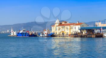 Coastal cityscape with Pasaport Dock and moored ships. Izmir city, Turkey