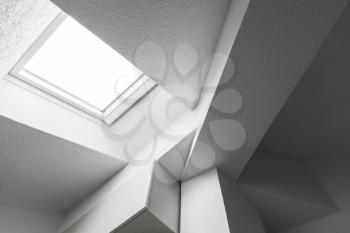 Abstract white interior fragment with ceiling, beams and window