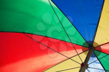 Abstract fragment of an colorful umbrella in a sunny day