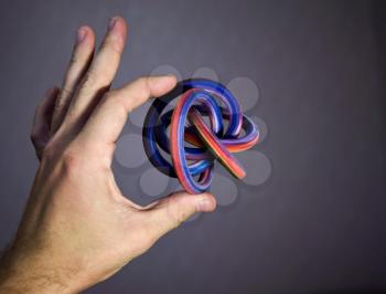 Extraordinary geometric solid object - toroidal knot as example of modern colorful 3d printing possibility
