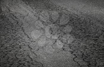 Closeup photo of damaged asphalt road