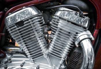 Shiny chromium-plated motorcycle engine closeup photo