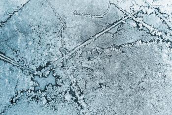 Abstract background with frost and ice crystal on the window glass