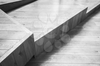 Abstract empty interior fragment, wooden stairs. Black and white photo with selective focus