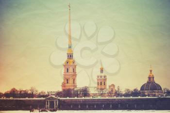 Peter and Paul fortress, one of the most popular landmarks of Saint-Petersburg, Russia. Vintage stylized photo with old paper texture and retro tonal correction filter effect 