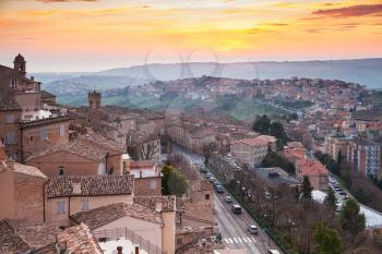 Small Italian town panorama under brignt morning sky. Province of Fermo, Italy