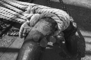 Ropes and mooring ring, closeup photo with selective focus