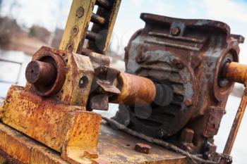 Old rusted engine with gears, close-up photo with selective focus