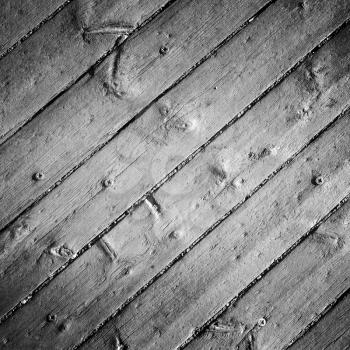 Old gray wooden floor with screws, detailed background photo texture