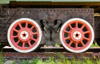 Red wheels with stars of railway gun system. Soviet railroad artillery system details