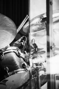 Vertical rock music photo background, drummer plays on cymbals, black and white