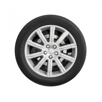 New automotive wheel on light alloy disc isolated on white background