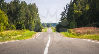 Empty rural highway perspective in summer day, European road landscape with selective focus and shallow DOF
