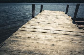 Empty wooden pier perspective, vintage tonal correction filter, old style effect