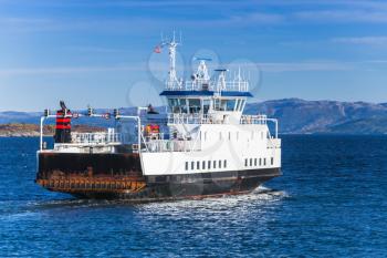 Ro-Ro ferry ship goes on Norwegian sea, rear view. Trondheim, Norway