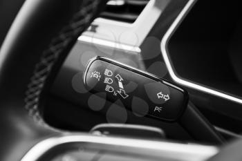 Headlights mode selector, modern car interior details
