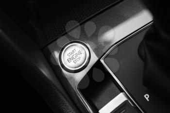 Modern luxury car interior detail, engine start stop button