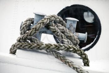 Mooring bollard with rope mounted on old ship deck