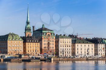 Morning cityscape of Gamla Stan city district in central Stockholm with German Church spire as a skyline dominant