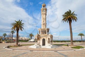 Konak Square street view with old clock tower, it was built in 1901 and accepted as the official symbol of Izmir City, Turkey