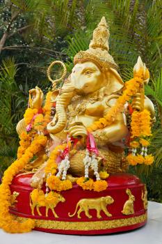 Lord Ganesha statue decorated with flowers
