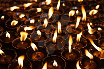 Many candles inside the Swayambhunath temple, Kathmandu