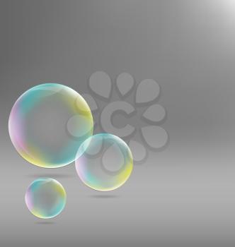 Three transparent soap bubbles with shadows on grayscale background