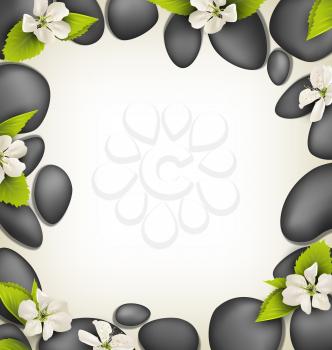 Spa stones with cherry white flowers like frame on beige background