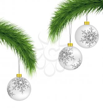 White Christmas balls on pine branches isolated on white background