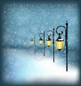 Lanterns stand in snowfall on blue background