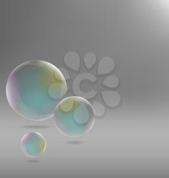 Three transparent soap bubbles with shadows on grayscale background