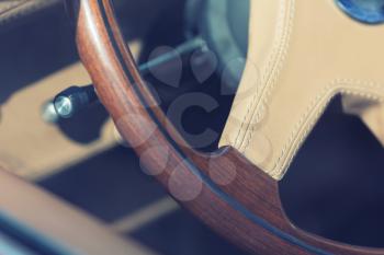 Wooden steering wheel of antique luxury car